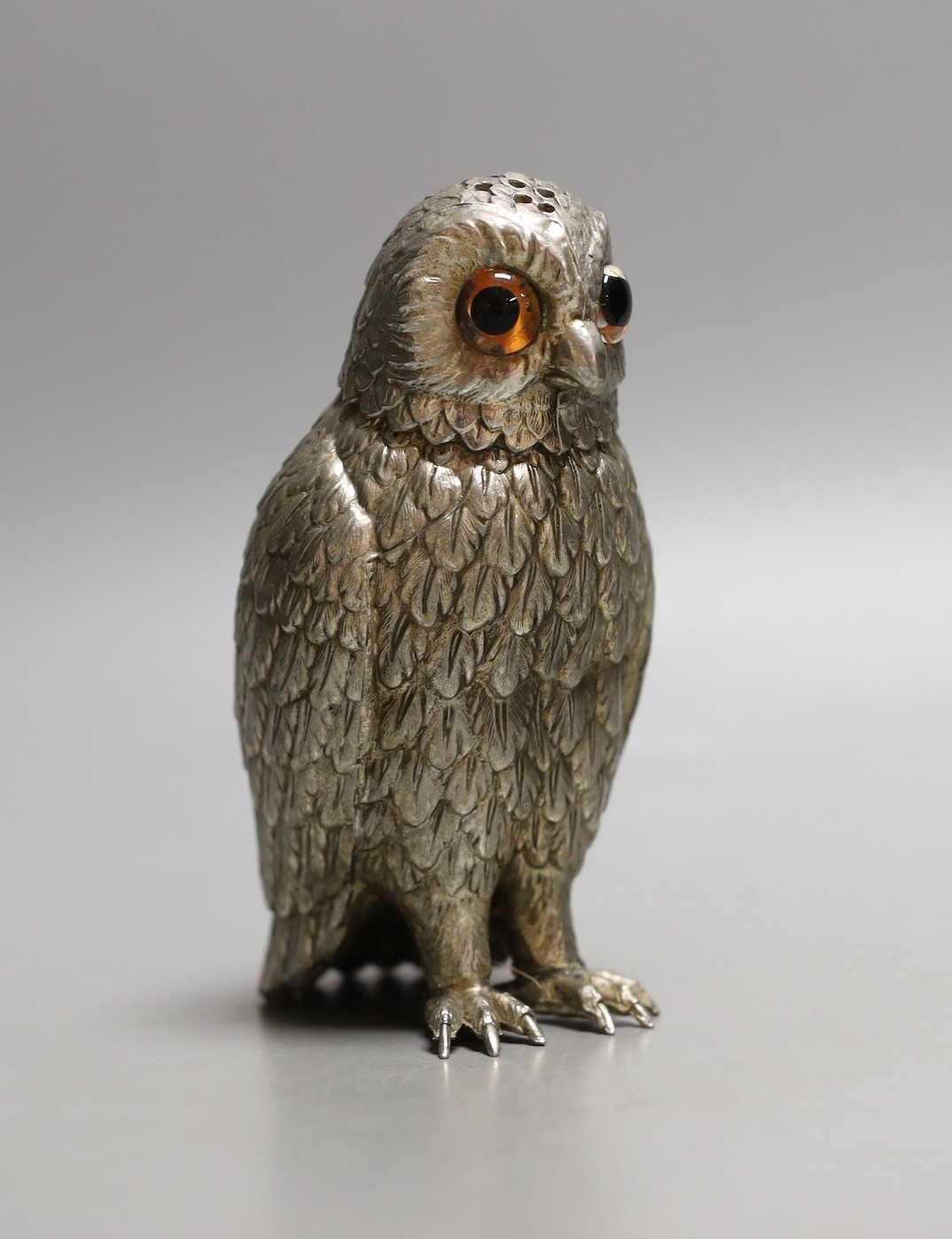 A silvered metal ‘owl’ sugar caster, 13cm